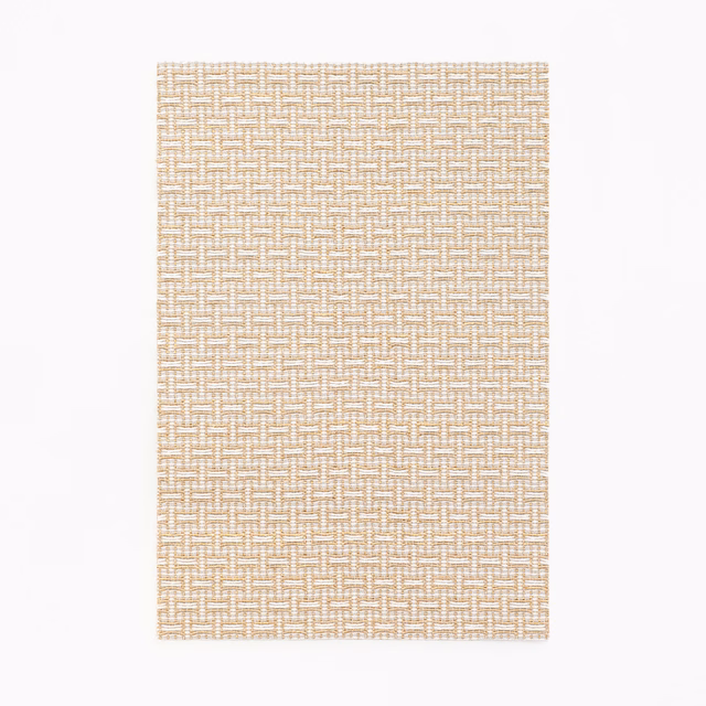 Warm champagne-beige jacquard with a fine interlocking geometric woven texture