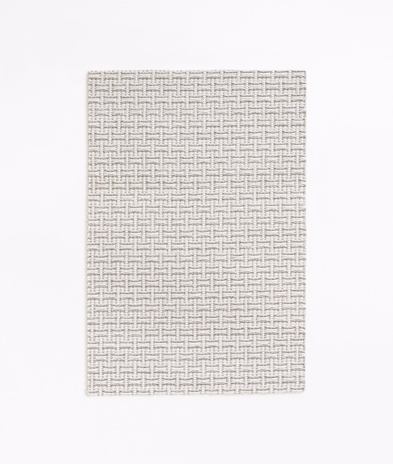 Pale greige jacquard swatch with a small interlocking geometric weave