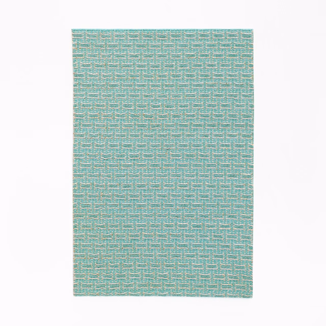 Cool mint-teal jacquard with pale broken geometric lines in a compact woven texture