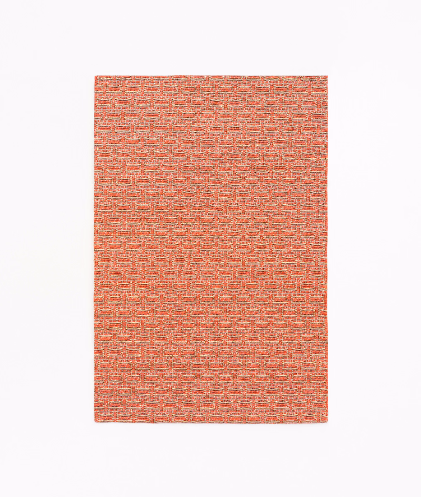 Coral-red jacquard swatch with a tightly repeated stepped geometric weave