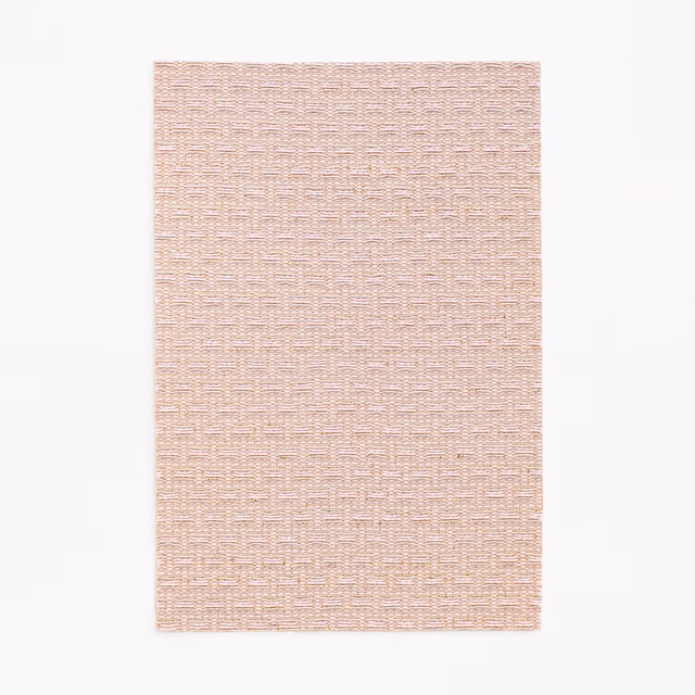 Pale blush jacquard with tiny broken bars and a softly pebbled weave