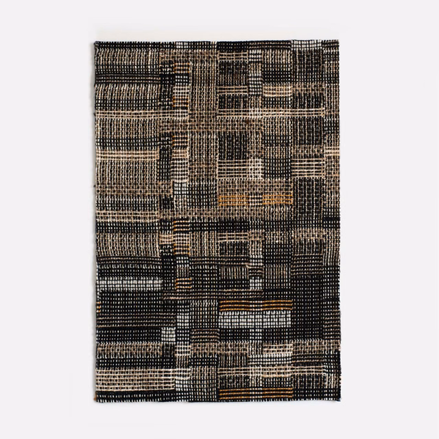 Charcoal jacquard with cream grid lines, taupe blocks and small ochre accents