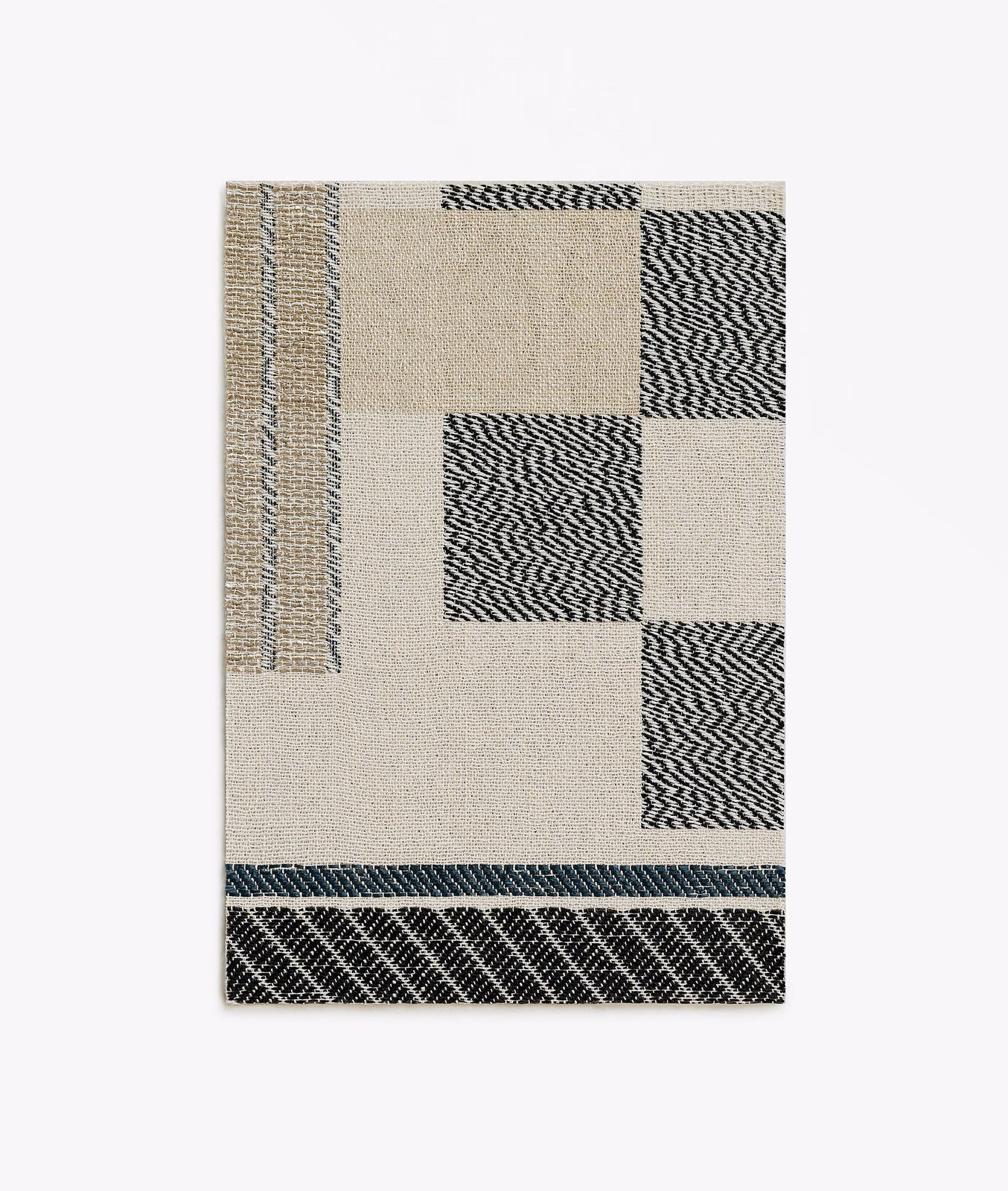 Black and silver zigzag blocks framed by ivory woven geometric panels