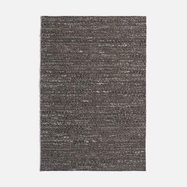 Charcoal grey Vézac Carbone jacquard with dense horizontal flecks and tactile woven texture