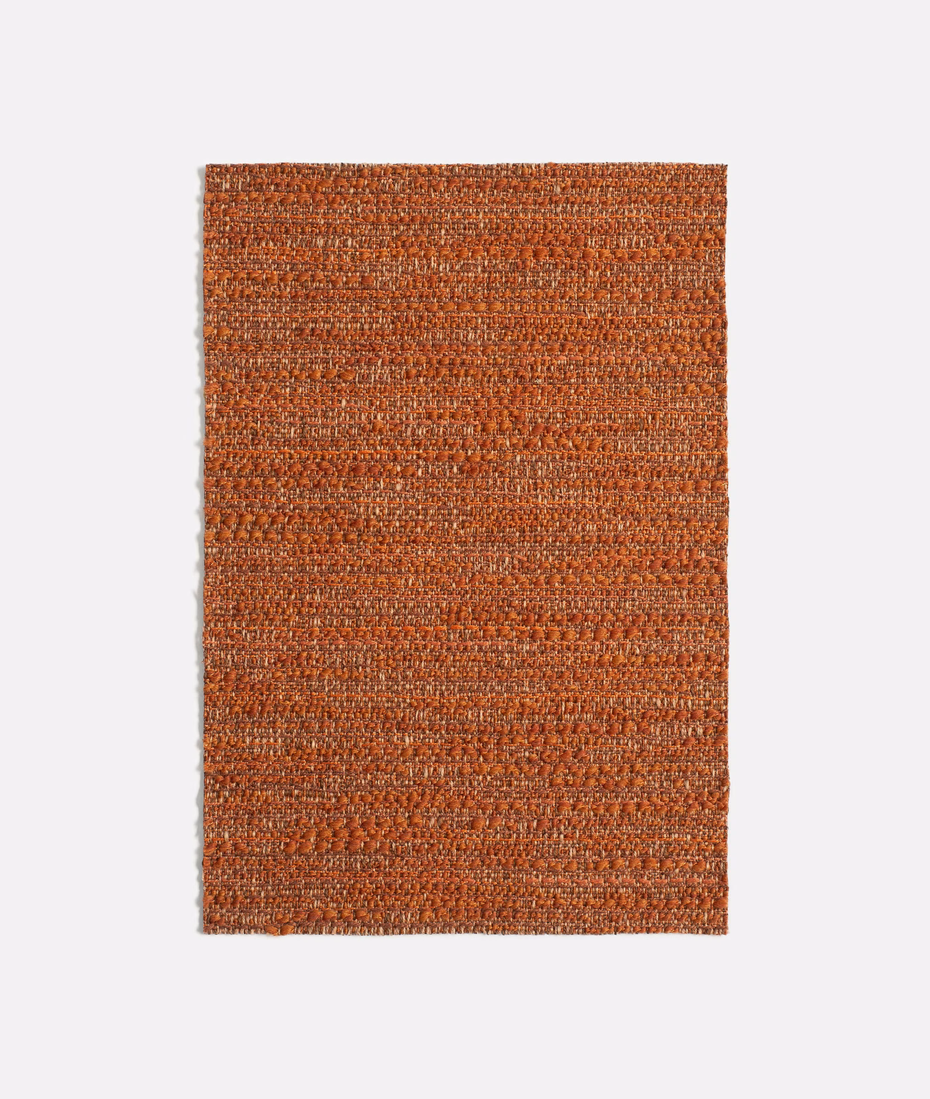 Rectangular Vézac Paprika swatch showing dense rust-red weave with copper and dark flecks