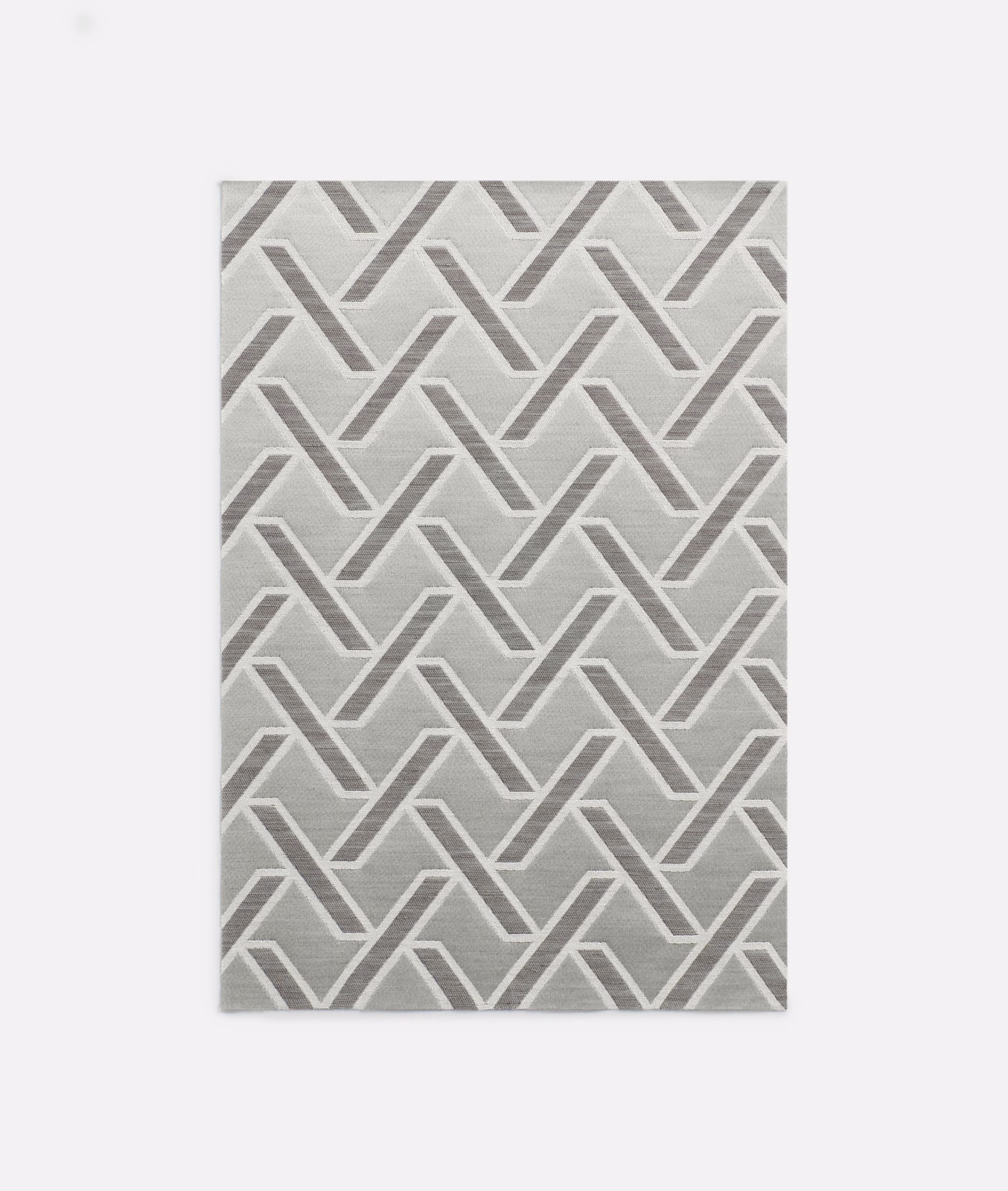 Soft grey jacquard with interlocking chevrons and a subtly textured woven surface