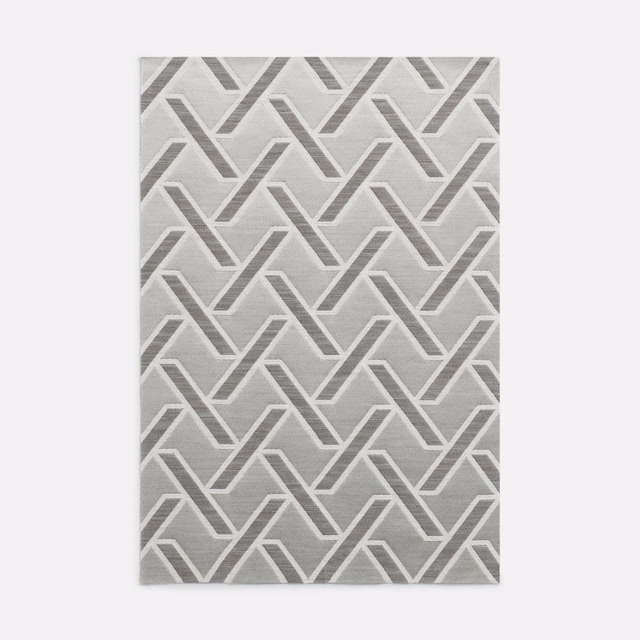 Soft grey jacquard with interlocking chevrons and a subtly textured woven surface