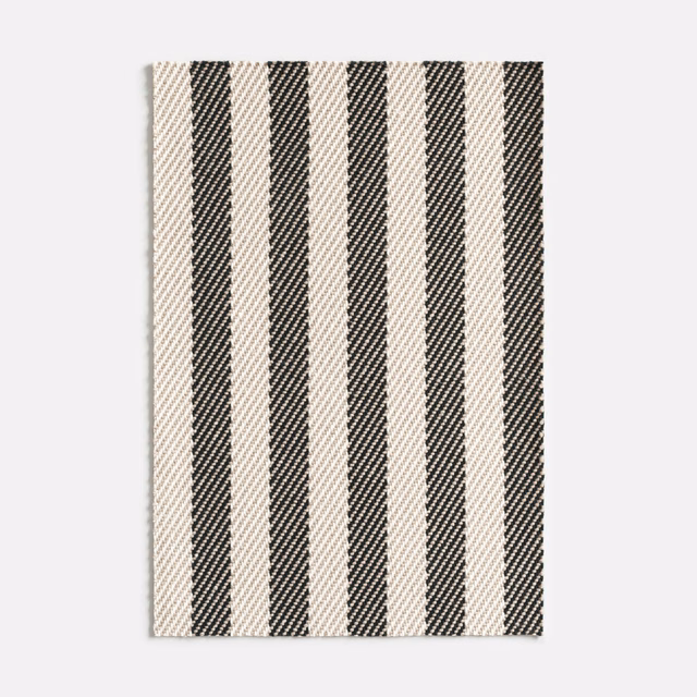 Cream jacquard swatch with near-black vertical herringbone stripes and fine woven texture