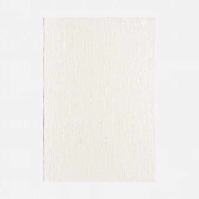 Pale Bianco fabric swatch with fine vertical linen-like striations and airy texture