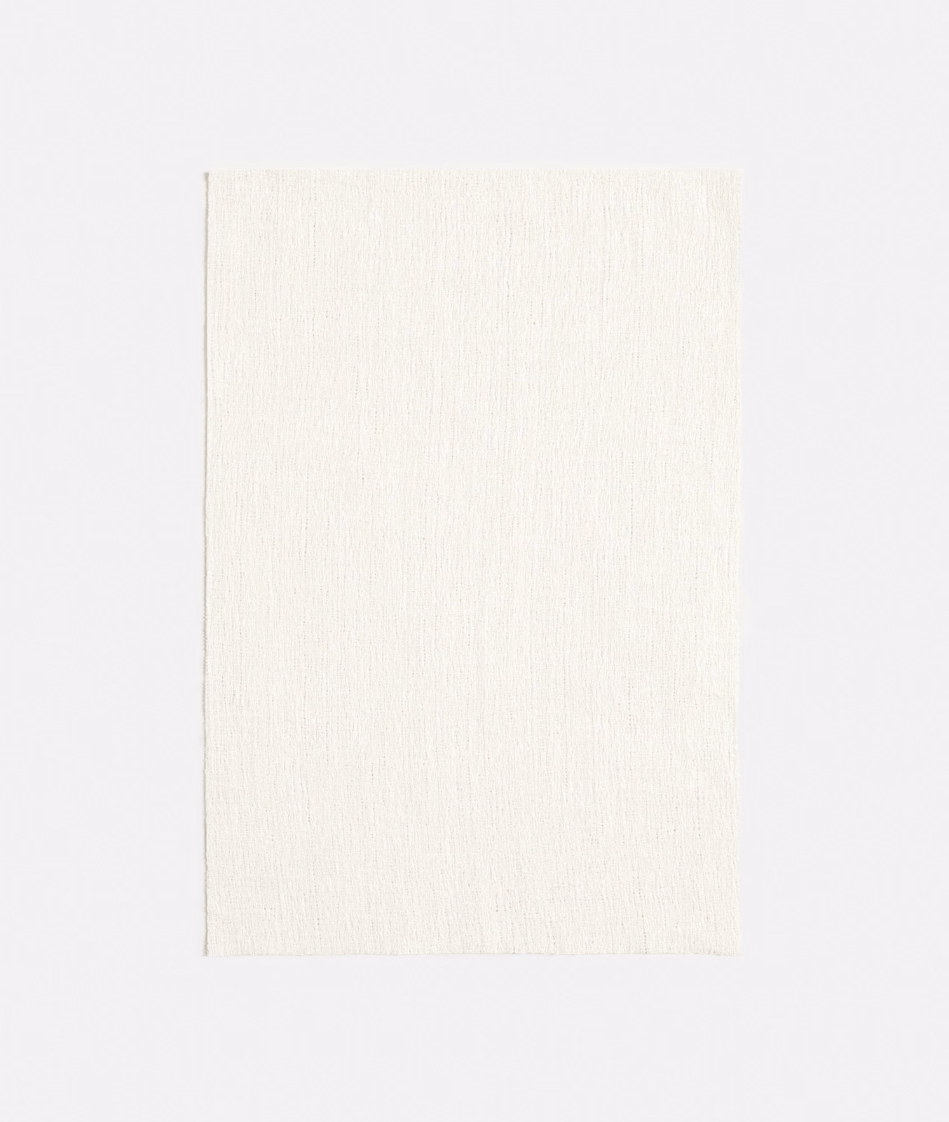 Soft ivory jacquard with fine vertical slub texture and delicate tonal variation