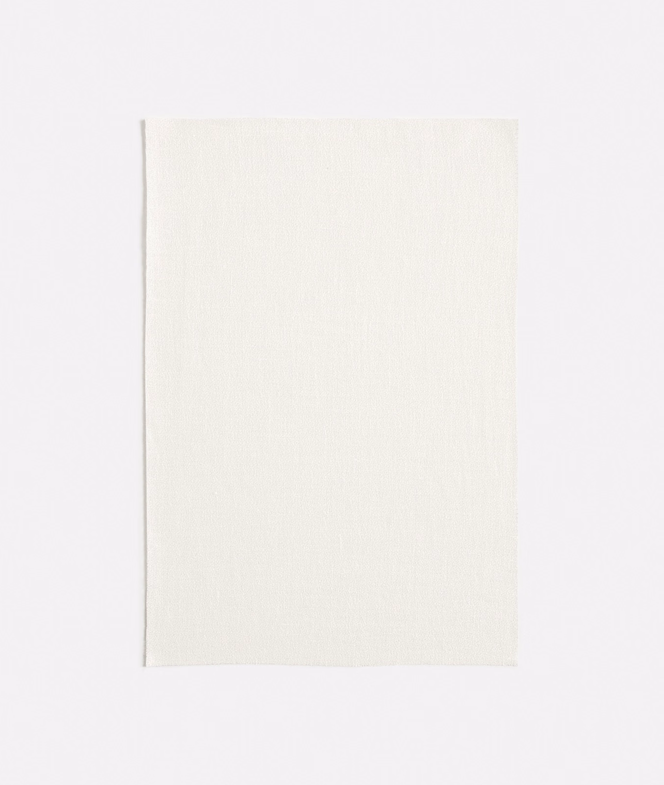 Warm ivory woven swatch with a fine, barely visible vertical grain