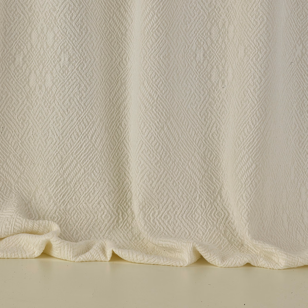 Warm ivory jacquard with fine vertical zigzags gathered into soft folds