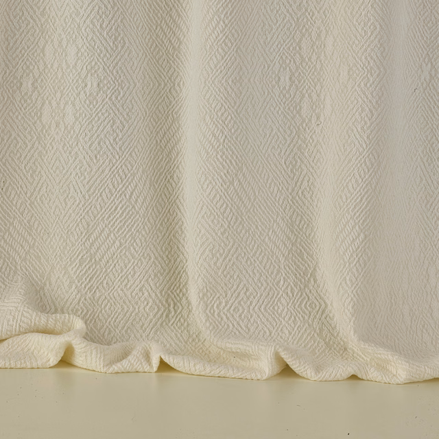 Warm ivory jacquard with fine vertical zigzags gathered into soft folds