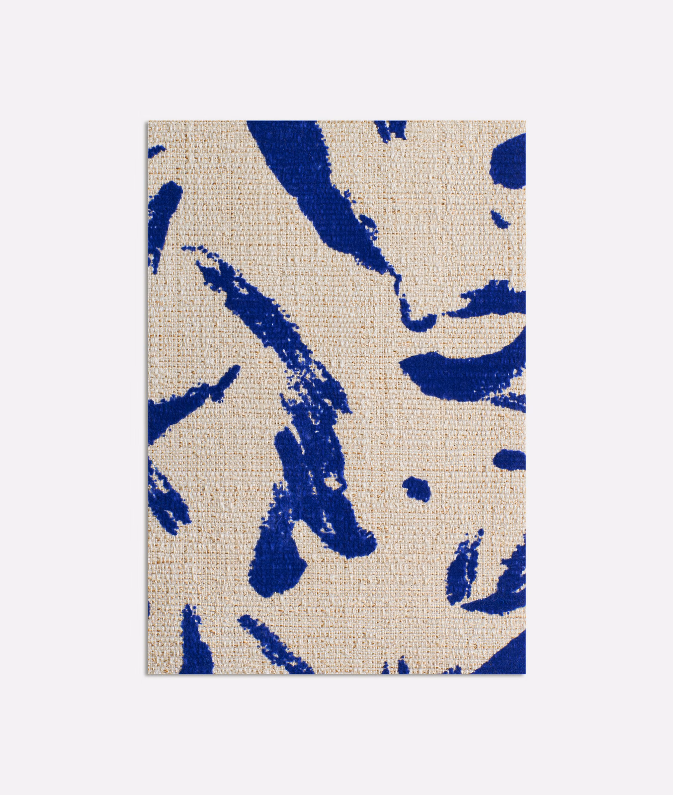 Cobalt blue abstract brush marks across a warm beige woven fabric