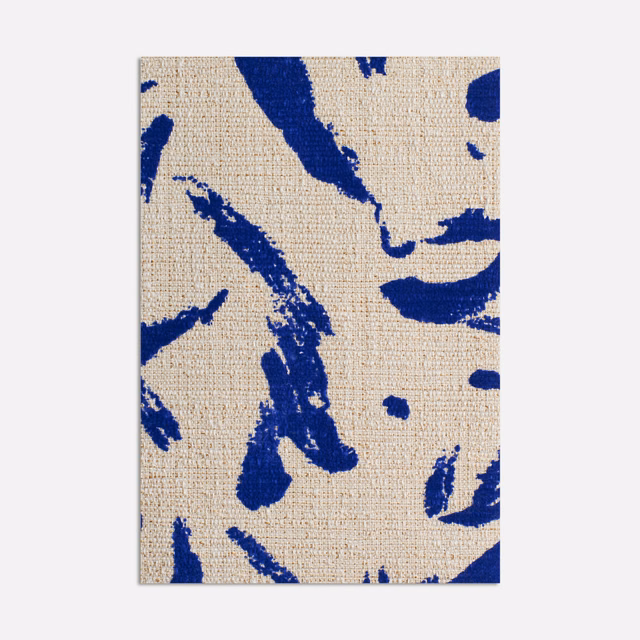 Cobalt blue abstract brush marks across a warm beige woven fabric