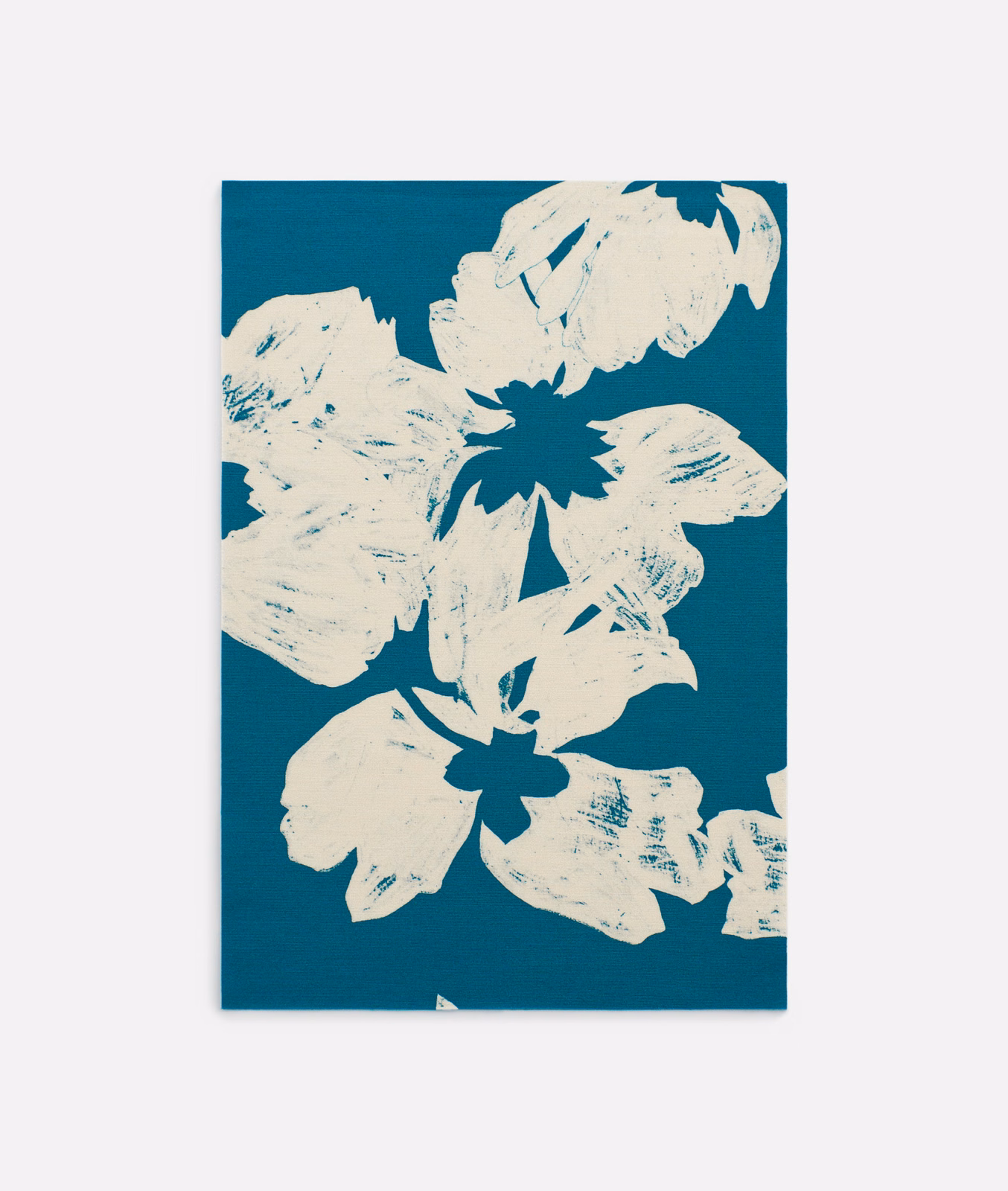 Deep teal fabric with oversized ivory flowers and expressive printed brush marks