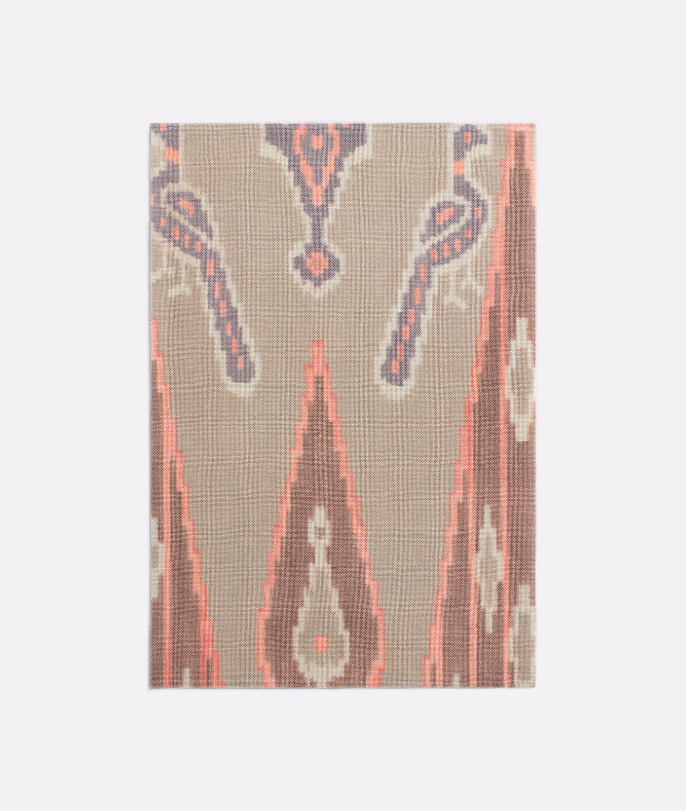 Warm taupe textile with coral, charcoal and cream stepped Persian geometric motifs