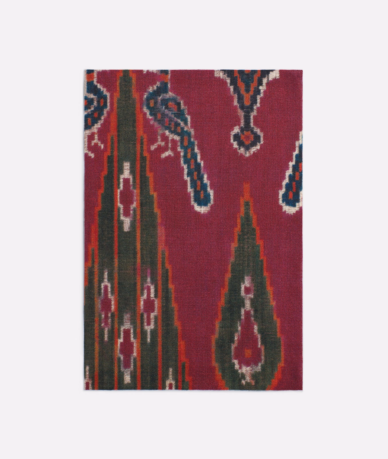 Deep burgundy printed textile with green, teal and cream Persian motifs