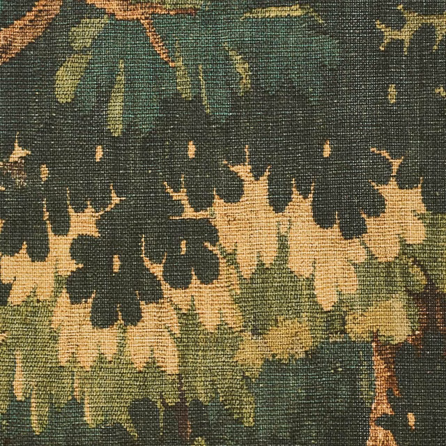Dark forest-green printed weave with cream foliage, ochre leaves and rust accents