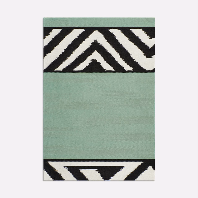 Aqua-green textile with black-and-ivory chevron bands and fine horizontal texture