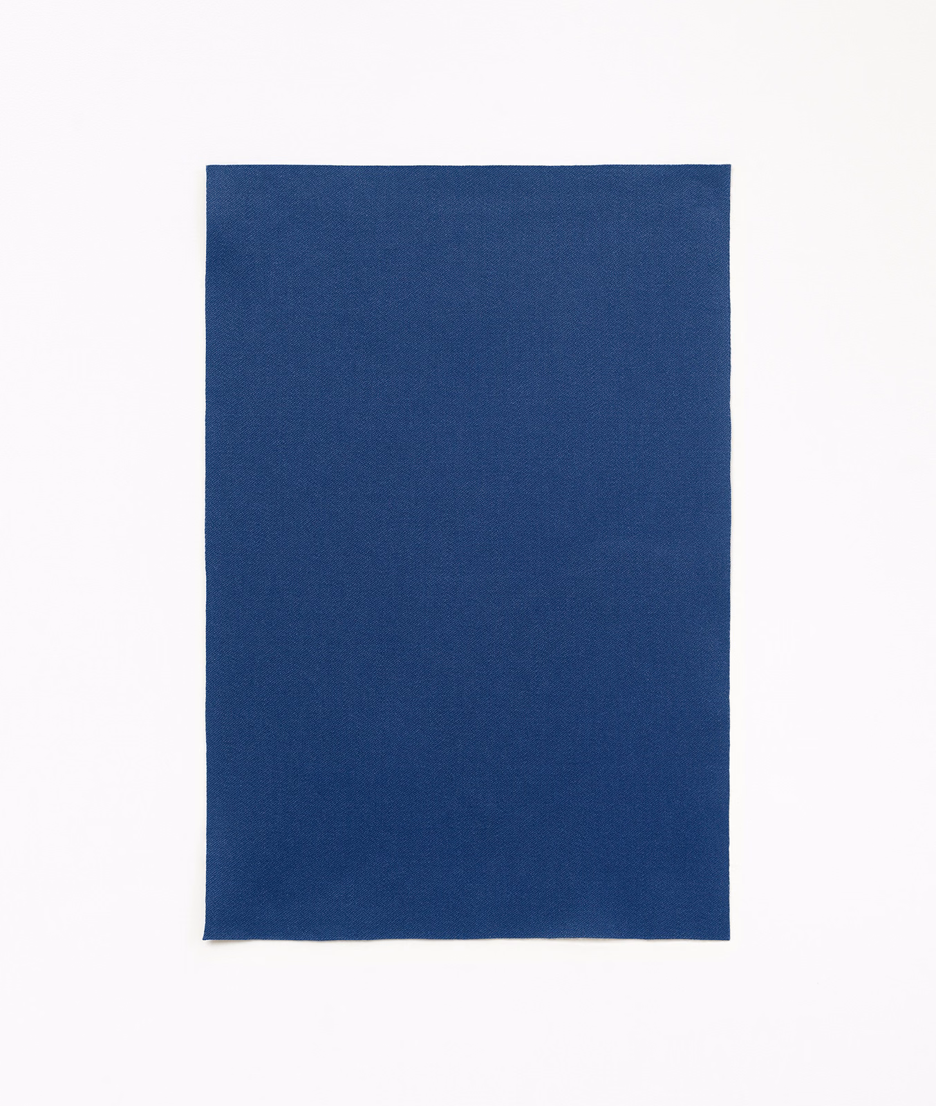 Deep Klein blue satin fabric with a smooth, subtly lustrous plain surface