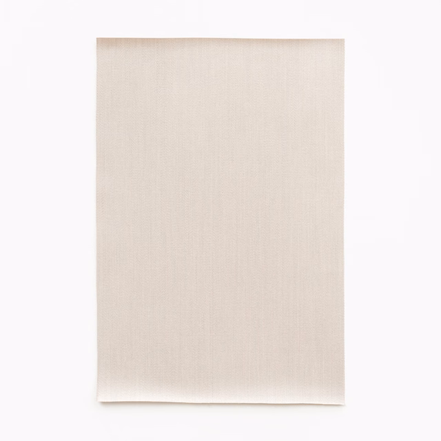 Pale beige satin with subtle vertical melange weave and softly curled lower edge