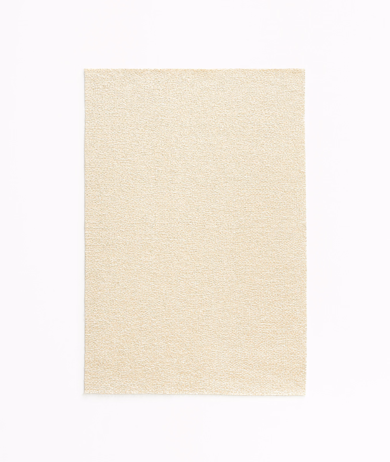 Close view of warm ivory satin weave with a fine, softly grainy surface