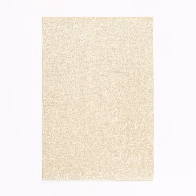 Close view of warm ivory satin weave with a fine, softly grainy surface