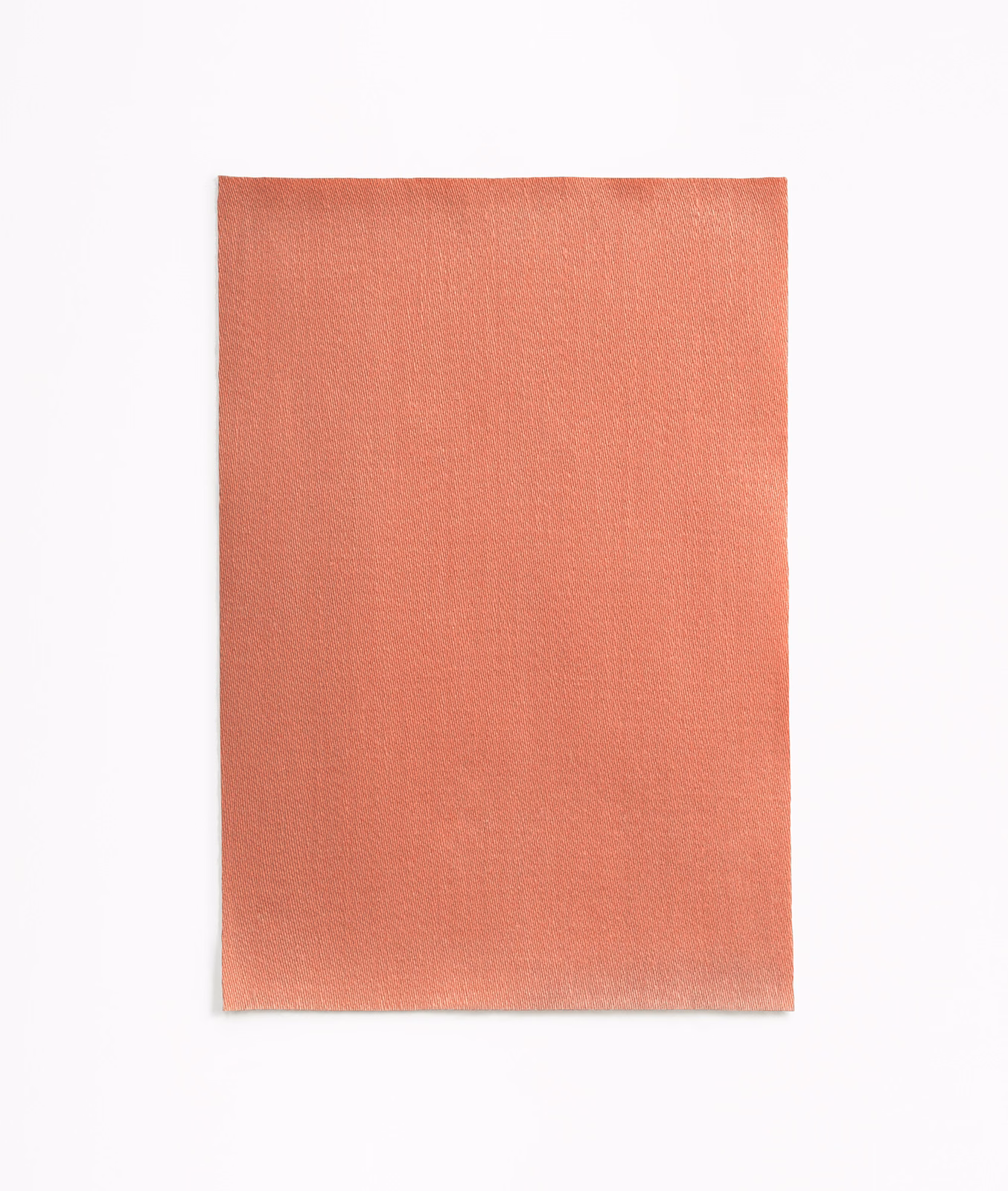 Warm coral-salmon satin swatch with a fine plain weave and subtle sheen