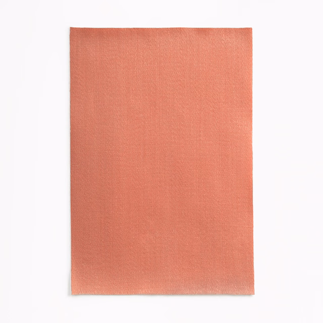 Warm coral-salmon satin swatch with a fine plain weave and subtle sheen