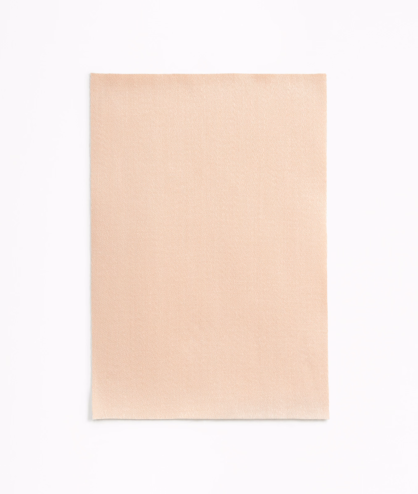 Pale peach satin swatch with a smooth weave and gentle surface sheen