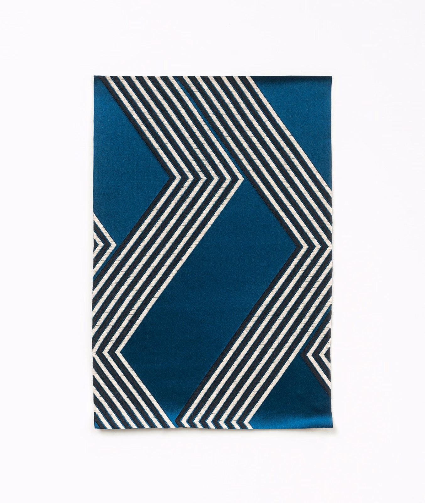 Deep teal satin swatch with ivory and charcoal angular chevron stripes