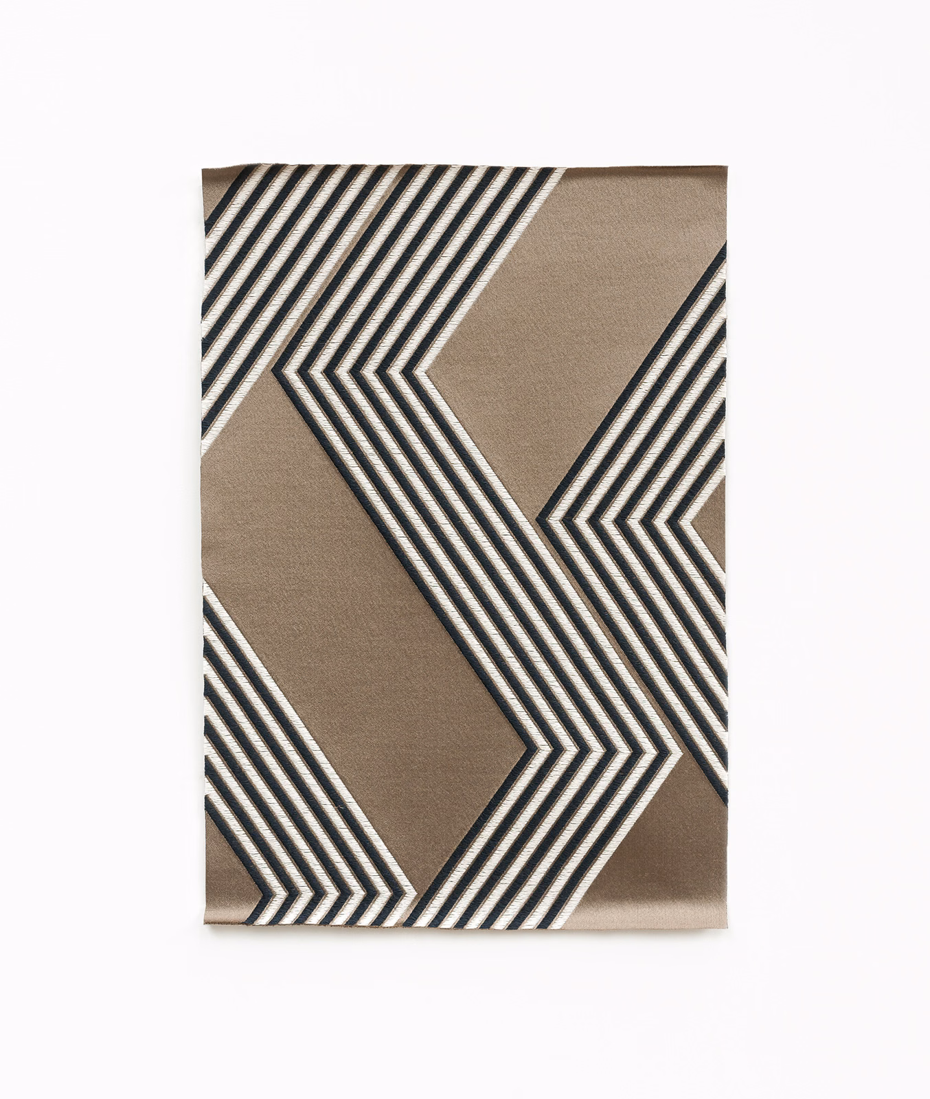Warm taupe fabric with bold charcoal, black and ivory angular chevron stripes