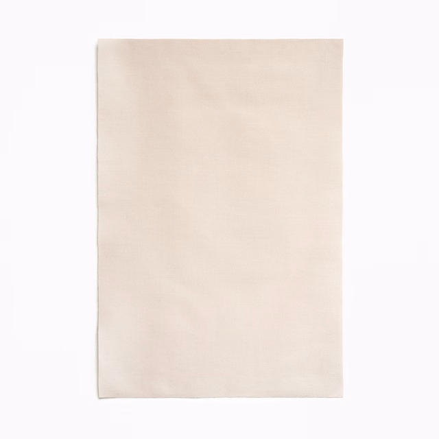 Pale warm ivory satin swatch with a smooth, softly reflective surface