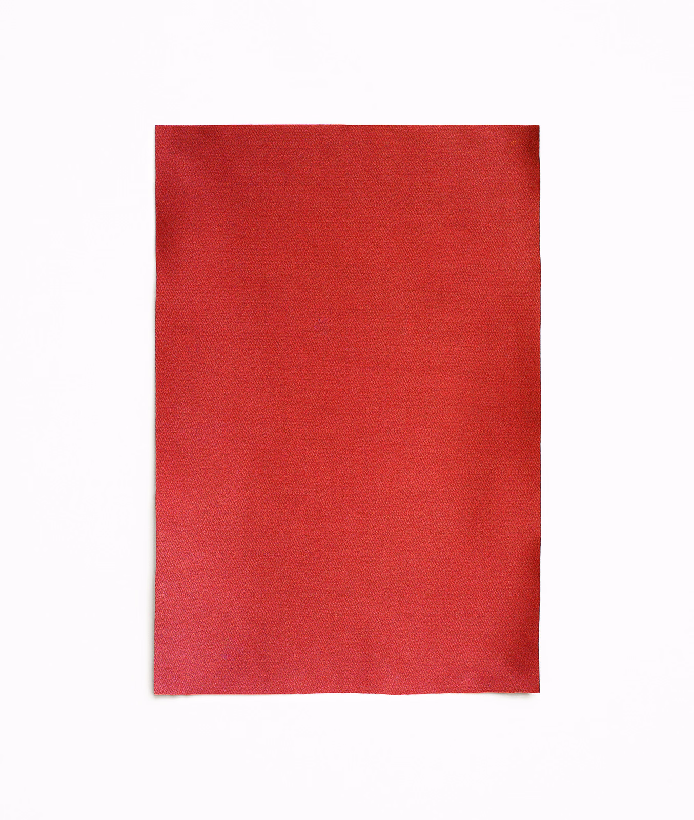 Close-up of rich crimson-red satin with a smooth, subtly lustrous plain weave