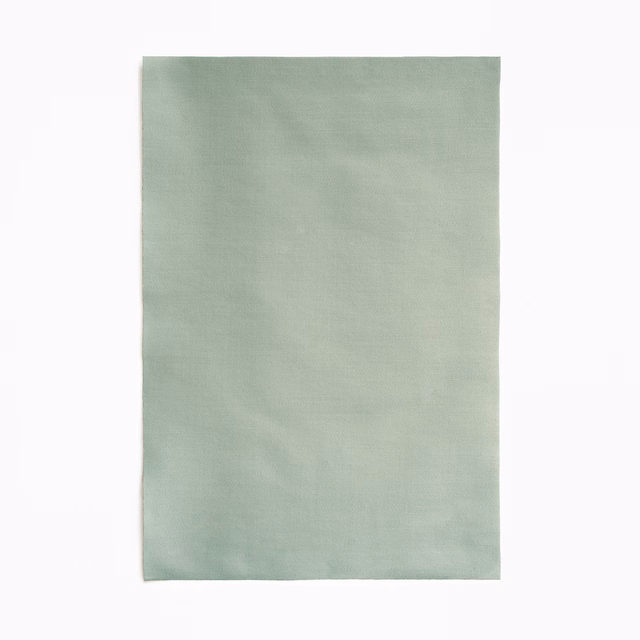 Pale sage-green satin with a soft sheen and subtle horizontal texture
