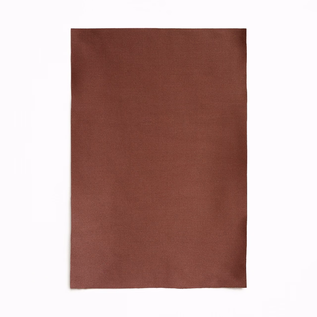 Muted brick-red satin swatch with a fine plain weave and subtle soft sheen