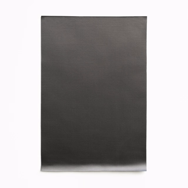 Deep charcoal satin swatch showing fine horizontal grain and subdued sheen