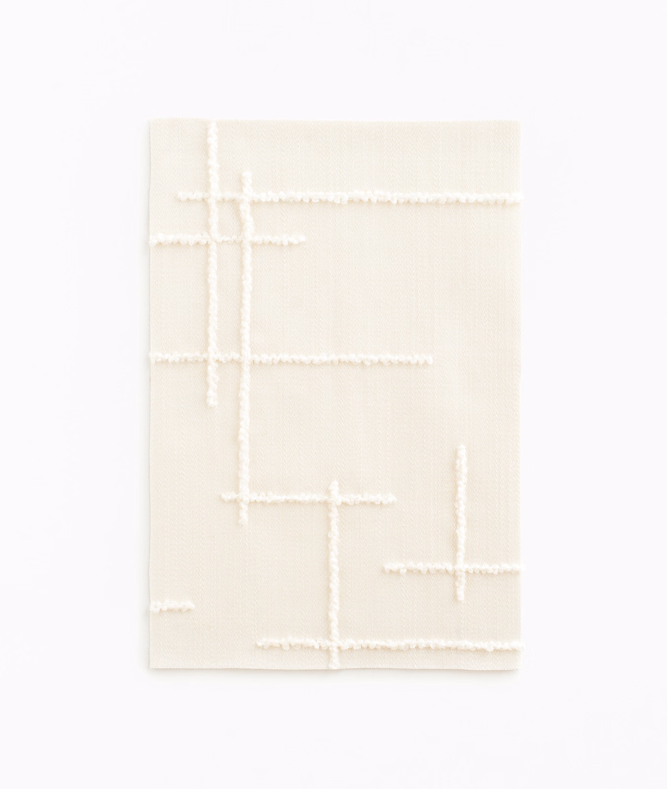 Pale magnolia satin ground with raised ivory broken-line geometric tracery