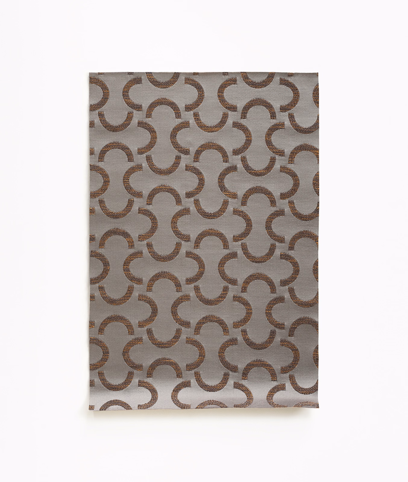 Taupe-grey satin weave with repeating brown interlocking crescent motifs