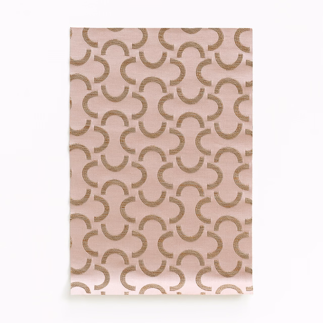Blush vieux rose satin ground with repeating taupe curved arc motifs