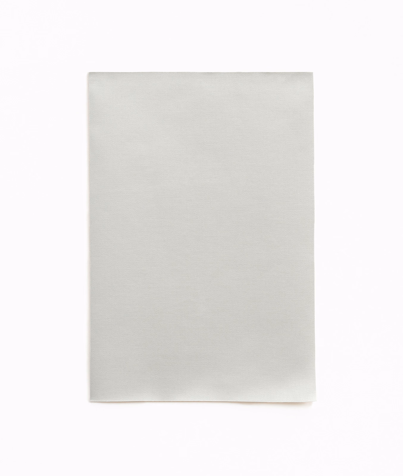 Pale cool-grey satin swatch with smooth horizontal sheen and softly luminous surface