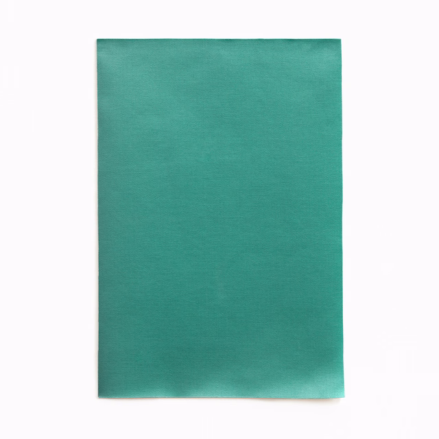 Saturated teal-green satin swatch with subtle horizontal texture and soft sheen