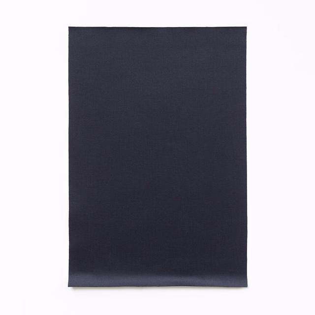 Near-black navy satin swatch with fine weave and soft lower-edge sheen
