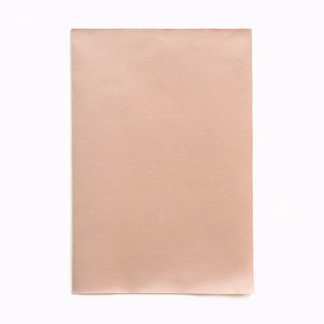 Pale blush nude satin swatch with a smooth, softly luminous horizontal texture
