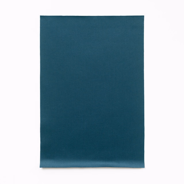 Deep blue teal satin swatch with a fine weave and subtle lower-edge sheen