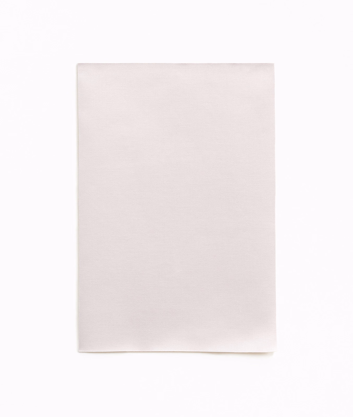 Pale dusty-pink satin swatch with a smooth surface and delicate reflective sheen
