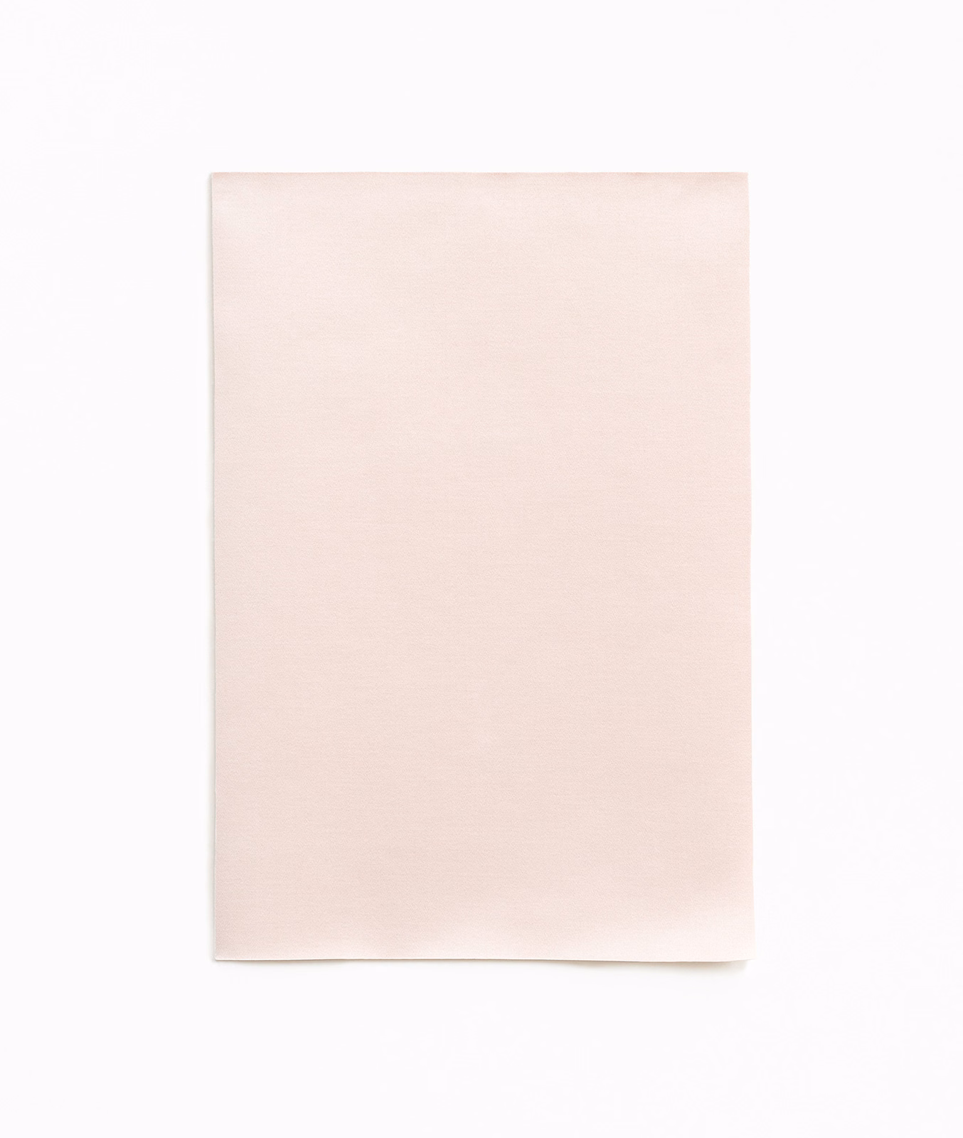 Pale blush-pink satin swatch with a soft, even surface sheen