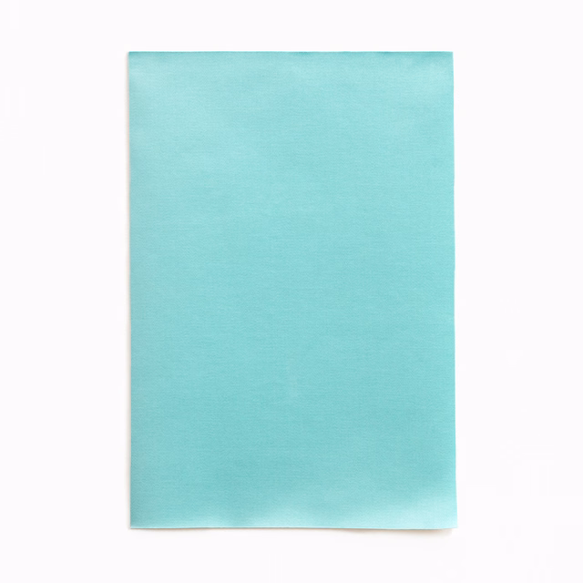 Close-up of smooth turquoise satin with soft aqua sheen and fine horizontal grain