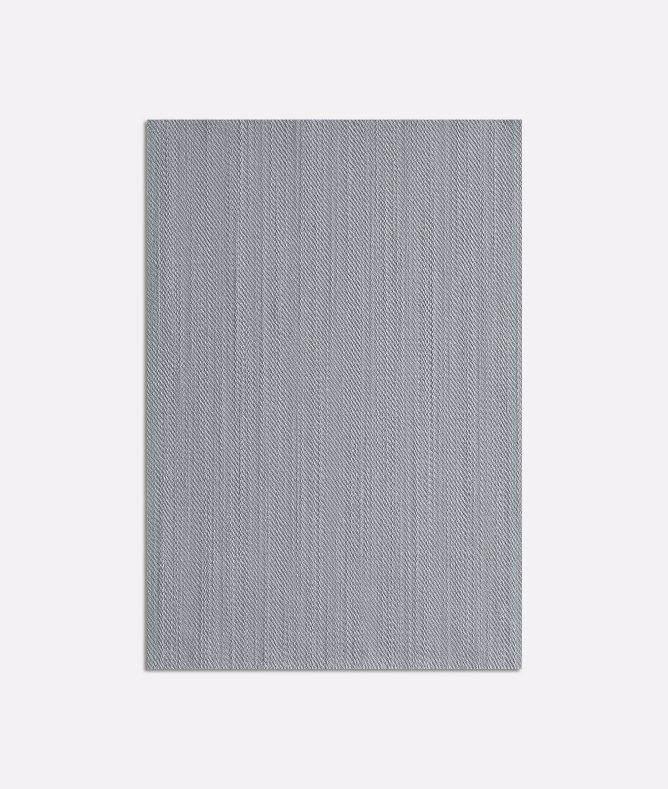 Cool pale blue-grey Tatin Cielo textile with a fine vertical woven texture